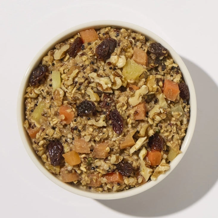 A bowl of oats with dried fruit and nuts from above
